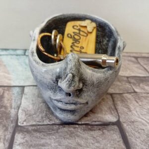 Dish in the shape of a half-head