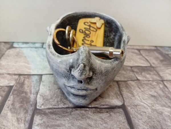 Dish in the shape of a half-head